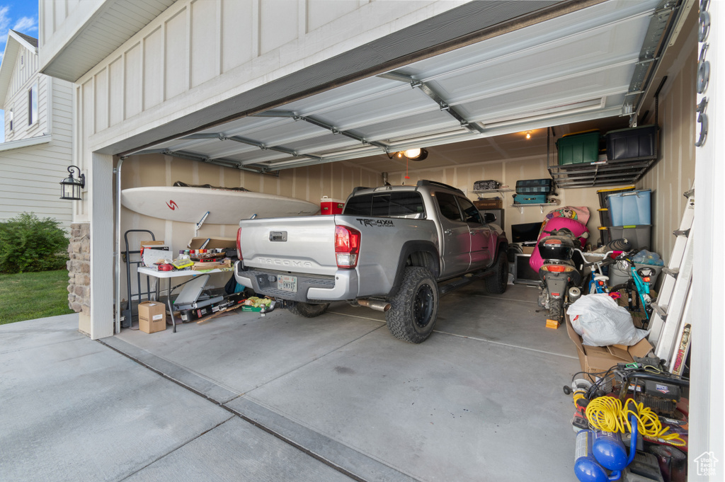 Garage featuring a garage door opener