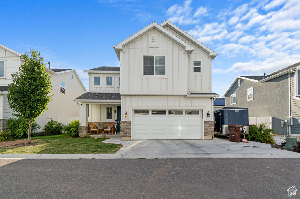 View of front of property with a garage