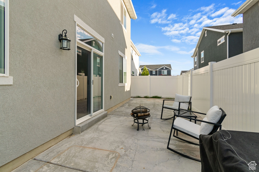 View of patio / terrace featuring an outdoor fire pit