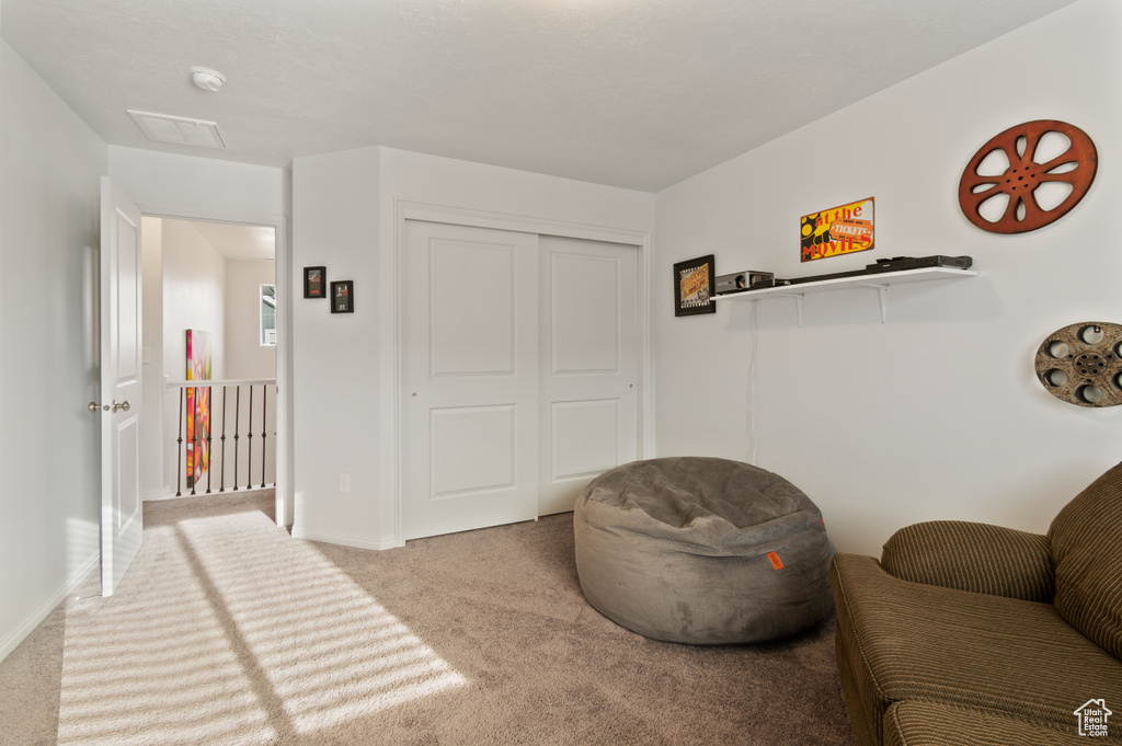 Sitting room with light colored carpet