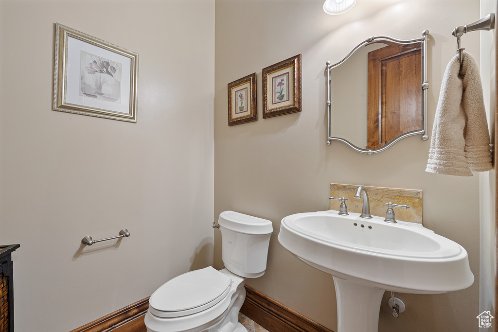 Bathroom featuring sink and toilet