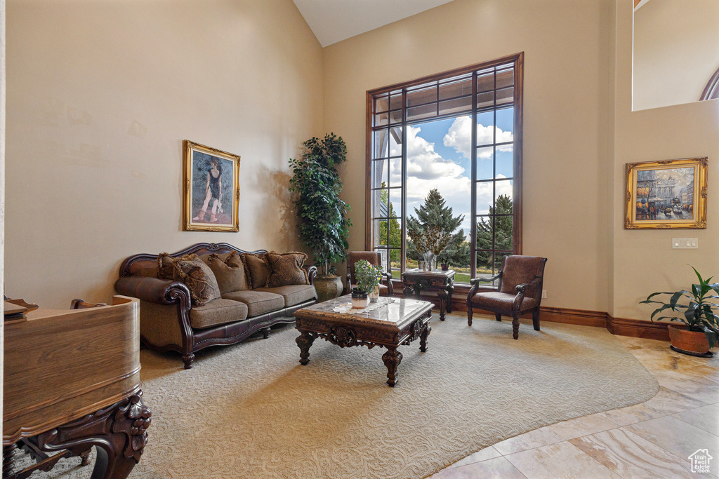 Living room with high vaulted ceiling