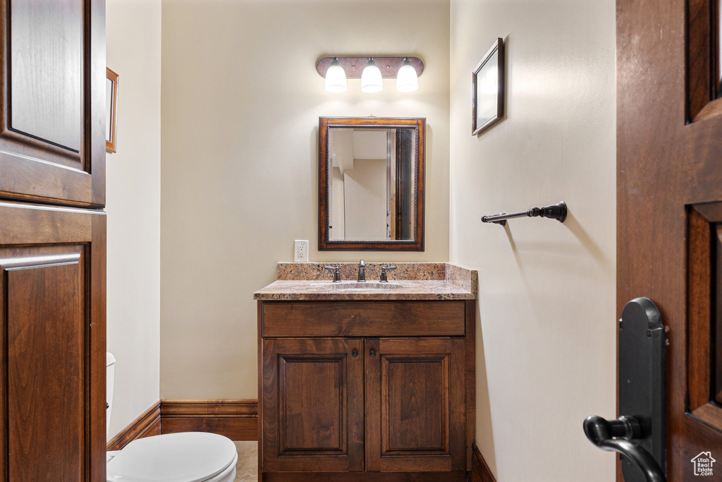 Bathroom featuring vanity and toilet