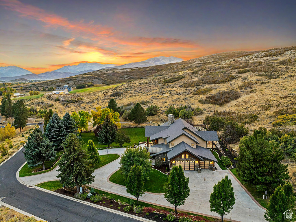 Aerial view at dusk featuring a mountain view