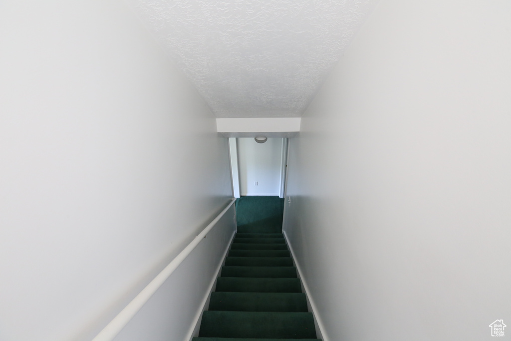 Stairway with a textured ceiling