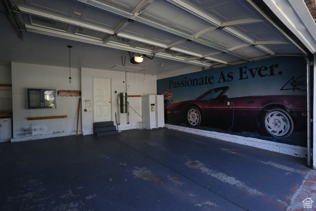 Garage featuring a garage door opener