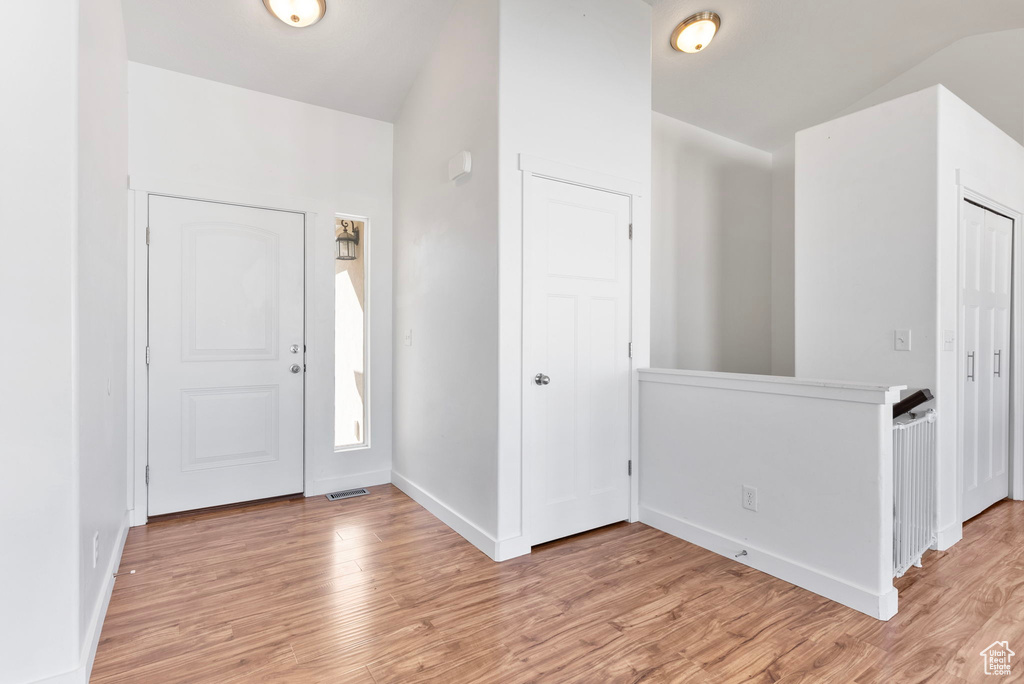 Entrance foyer featuring light hardwood / wood-style flooring