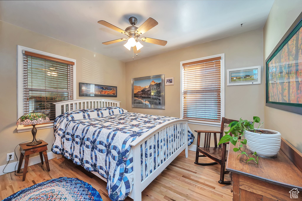 Bedroom featuring ceiling fan and light wood-type flooring