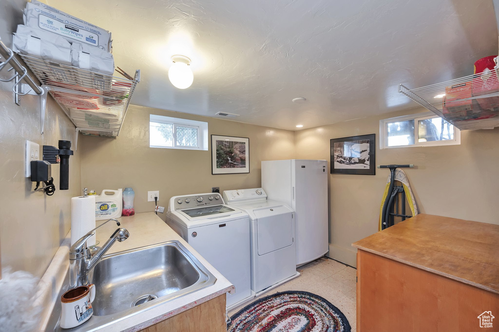 Clothes washing area with washing machine and clothes dryer and sink