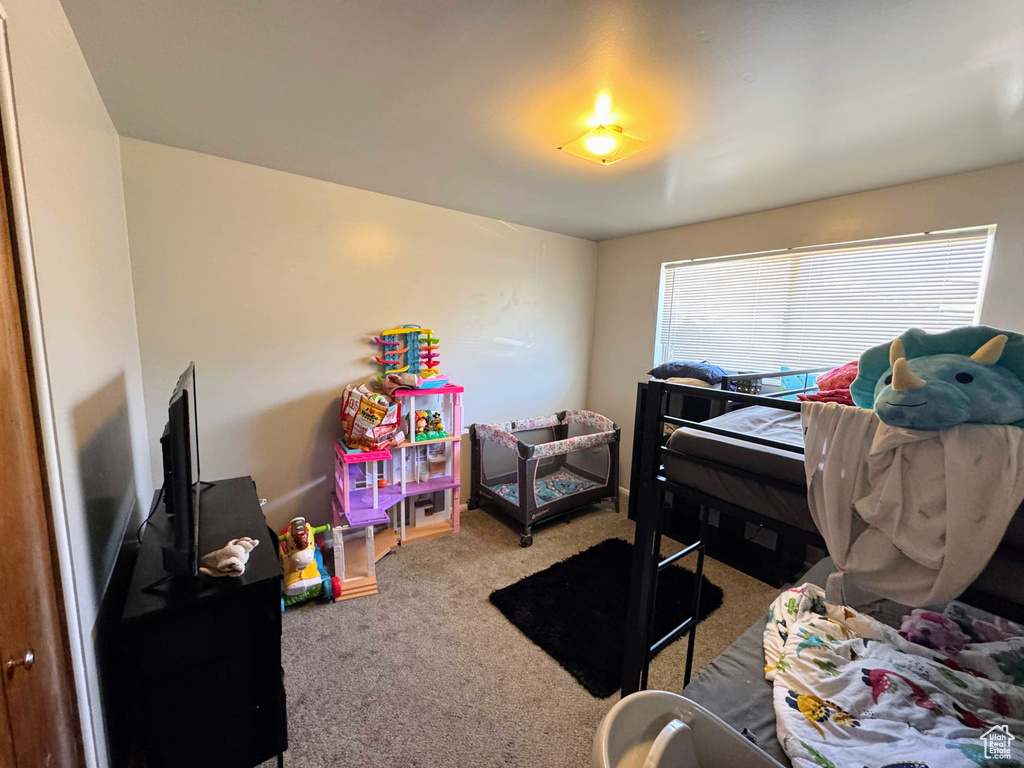 Bedroom featuring carpet floors