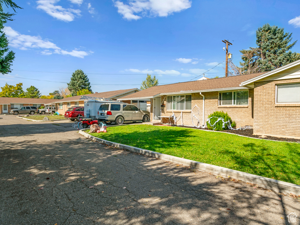 Single story home featuring a front yard