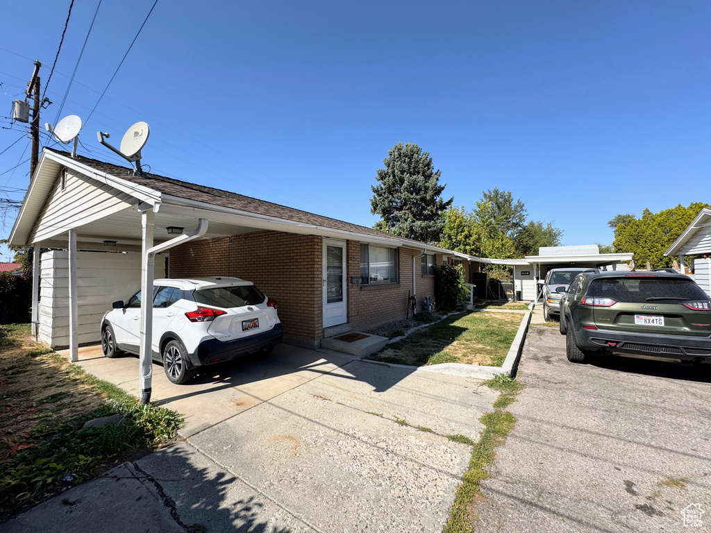 View of front of home with a carport