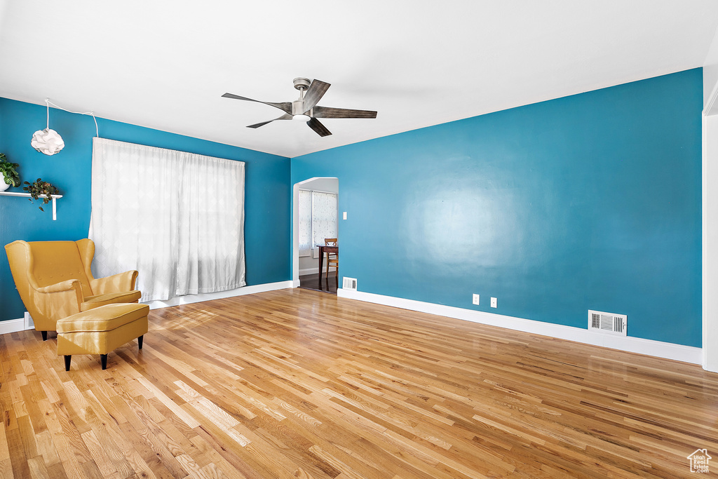 Unfurnished room featuring wood-type flooring and ceiling fan