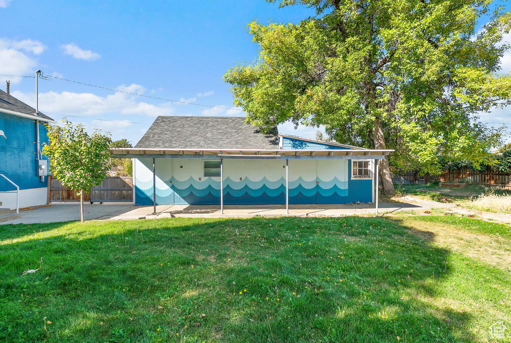 Back of house featuring a patio and a yard