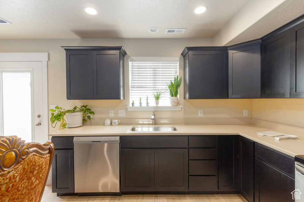 Kitchen featuring sink and stainless steel dishwasher