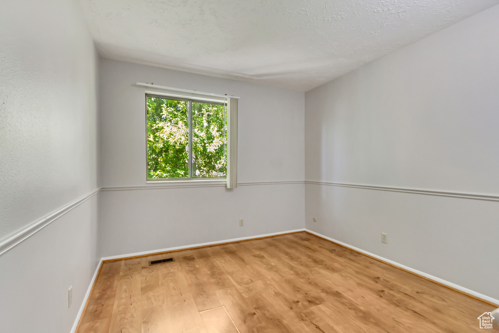 Empty room featuring light hardwood / wood-style floors