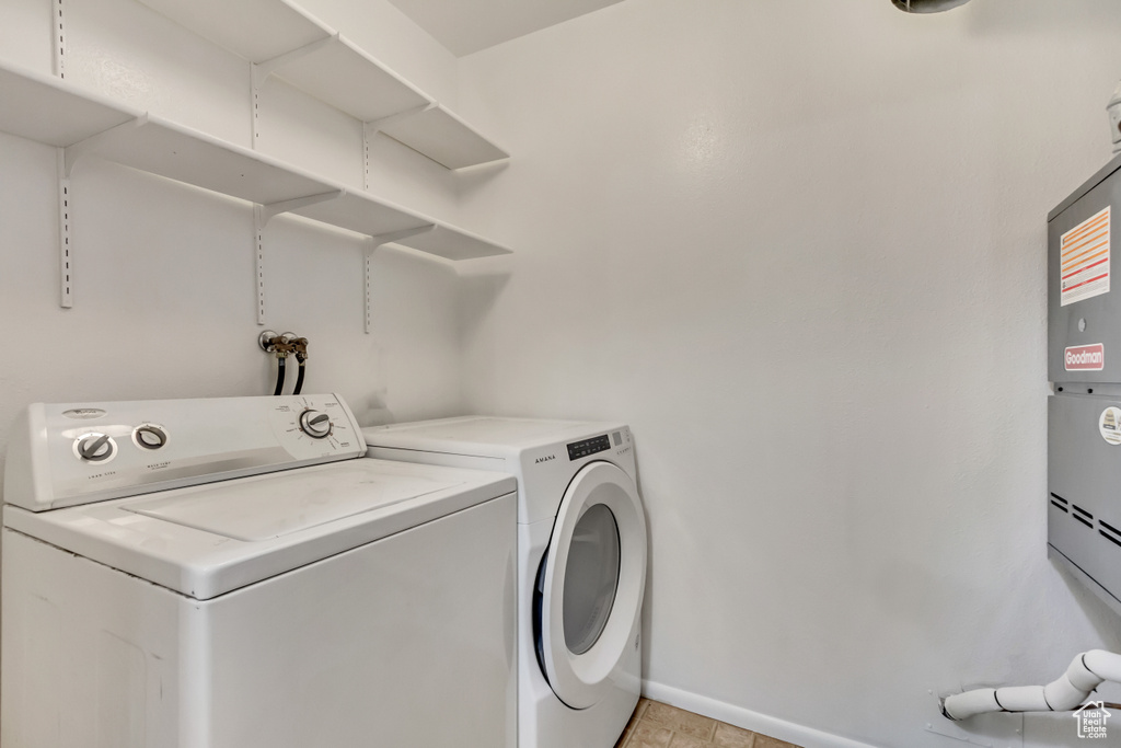 Washroom with washer and clothes dryer