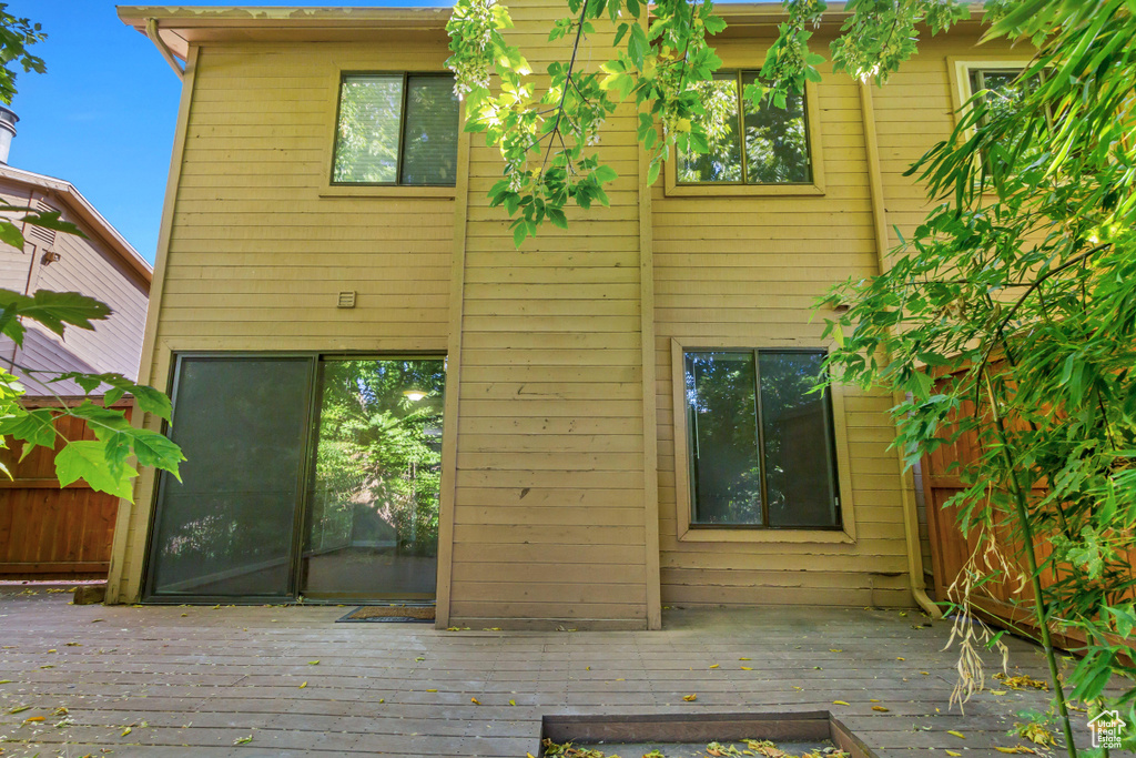 Rear view of property featuring a deck