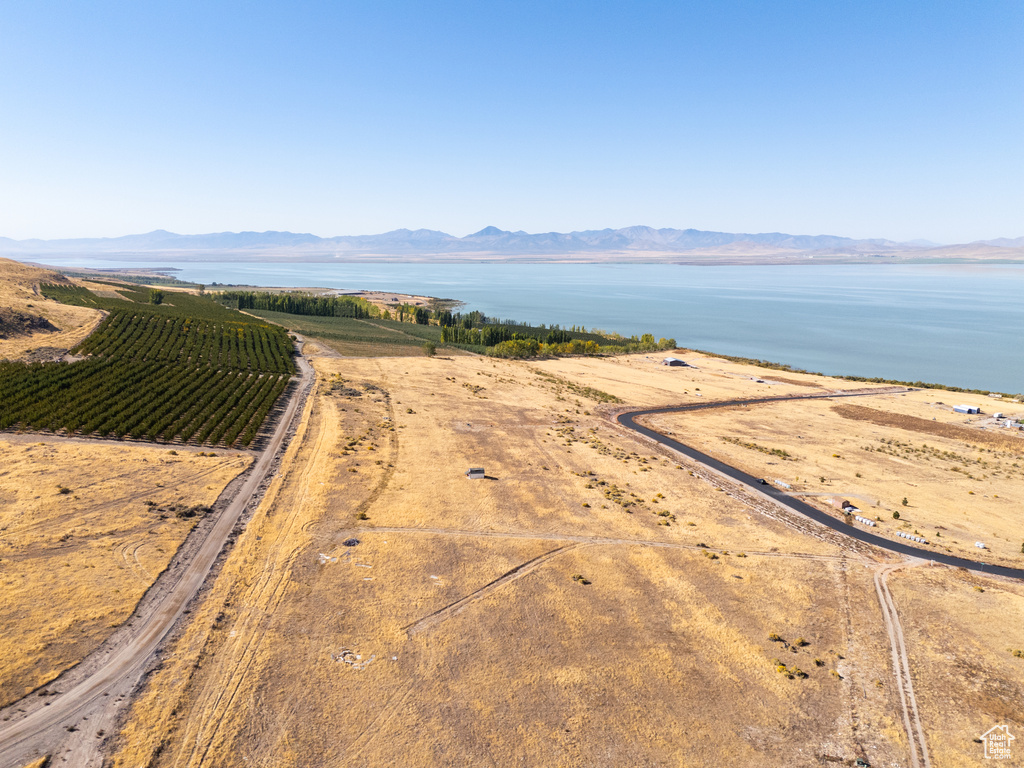 Property view of water with a mountain view and a rural view