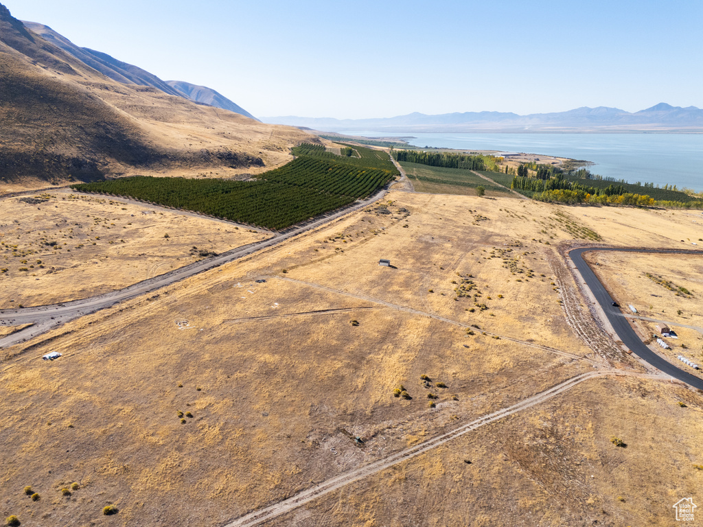 Drone / aerial view featuring a rural view and a water and mountain view