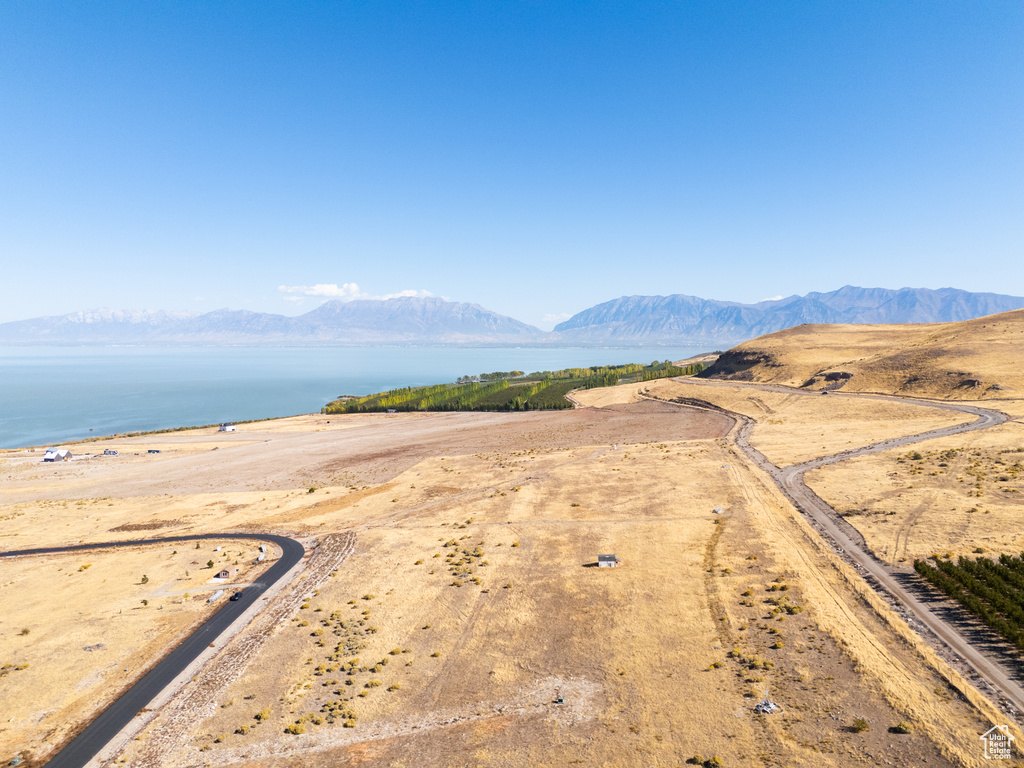 Drone / aerial view with a water and mountain view