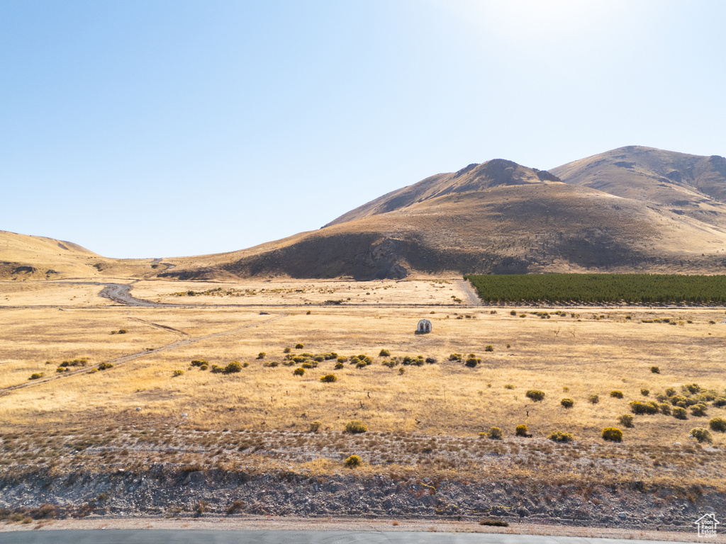 Property view of mountains with a rural view