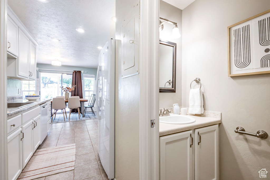 Bathroom featuring tile patterned floors and vanity