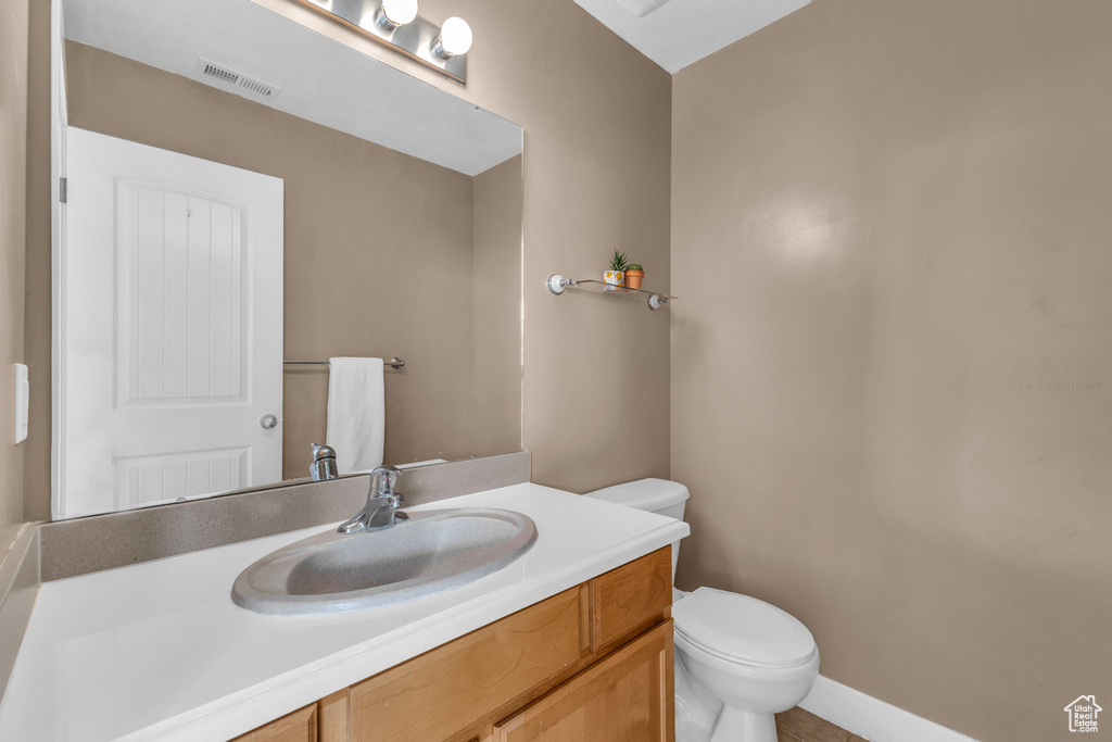 Bathroom with vanity and toilet