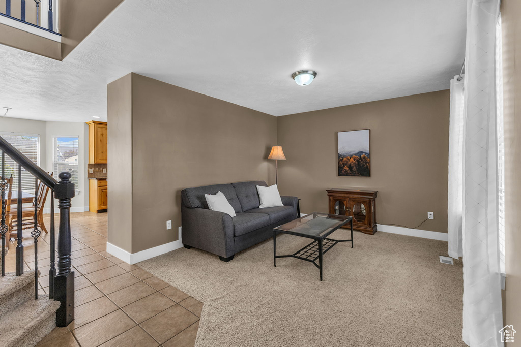 Tiled living room with a textured ceiling