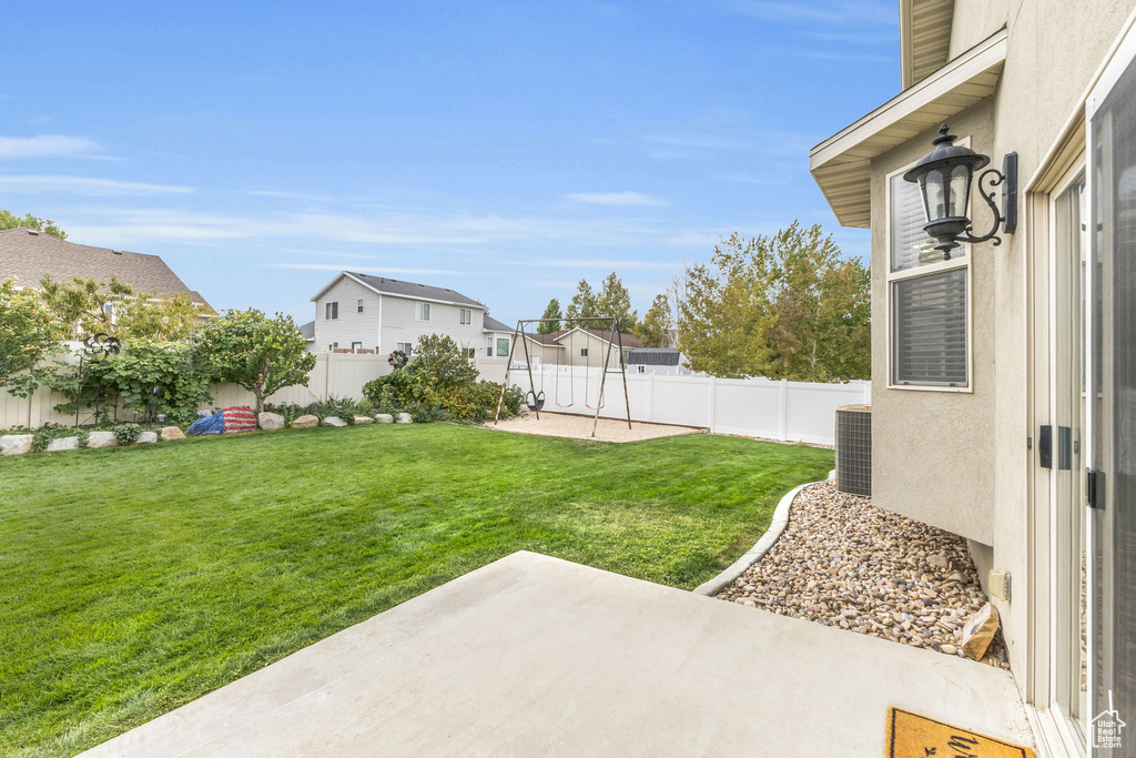 View of yard featuring a patio and central AC