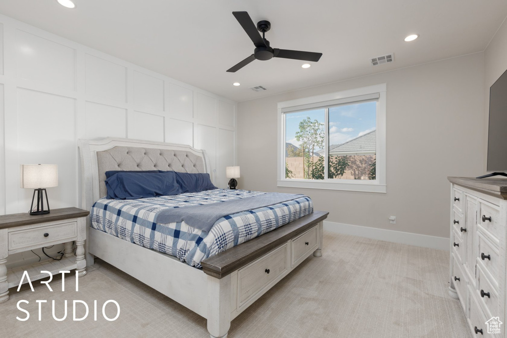 Bedroom featuring ceiling fan and light carpet