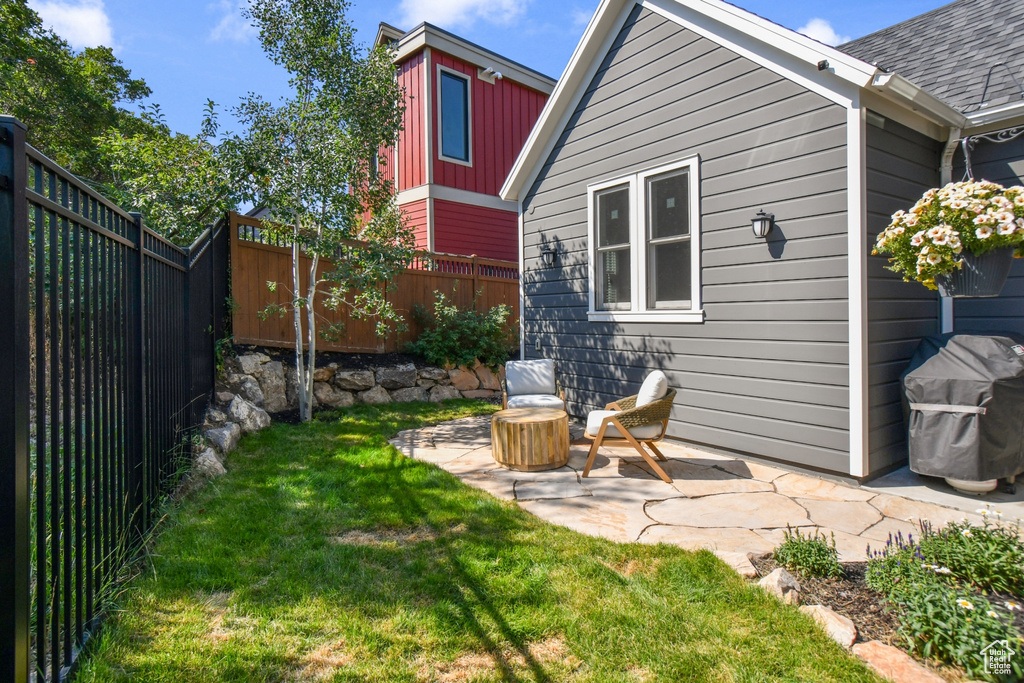 View of yard with a patio area