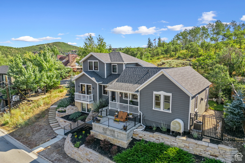 Back of property featuring a mountain view