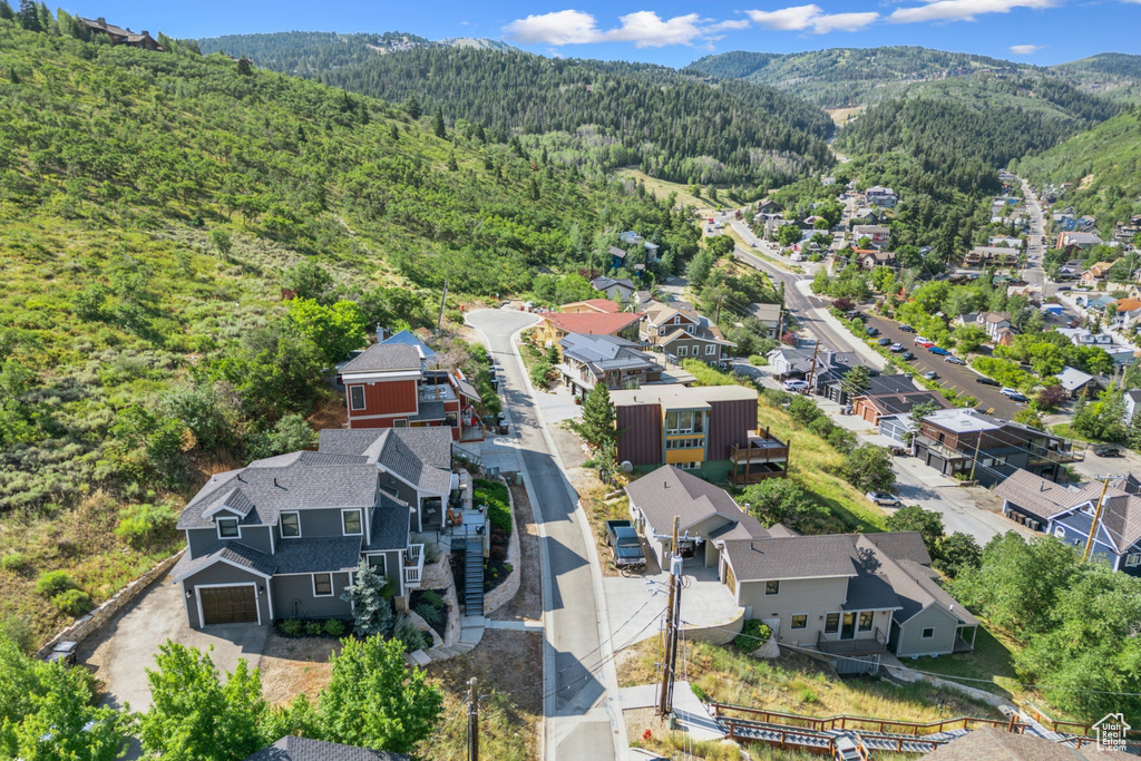 Birds eye view of property with a mountain view