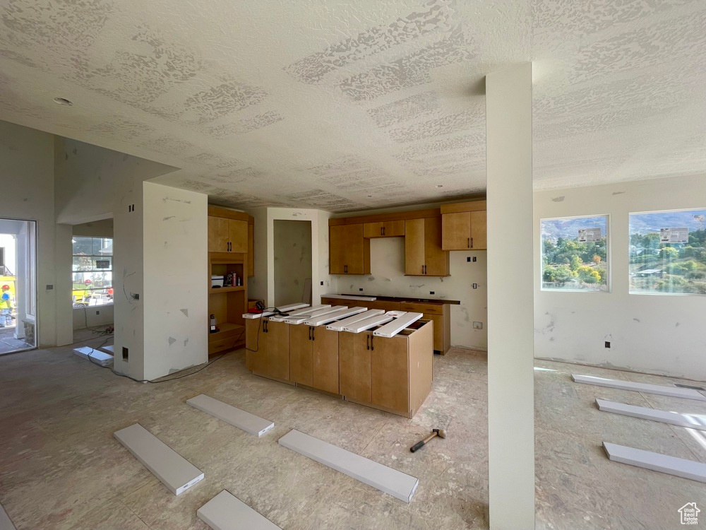 Kitchen with plenty of natural light and a textured ceiling