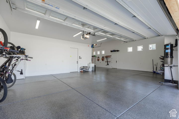 Garage featuring a garage door opener