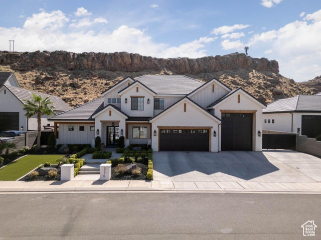 Modern farmhouse with a mountain view and a garage