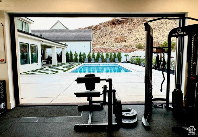 View of swimming pool with a patio area