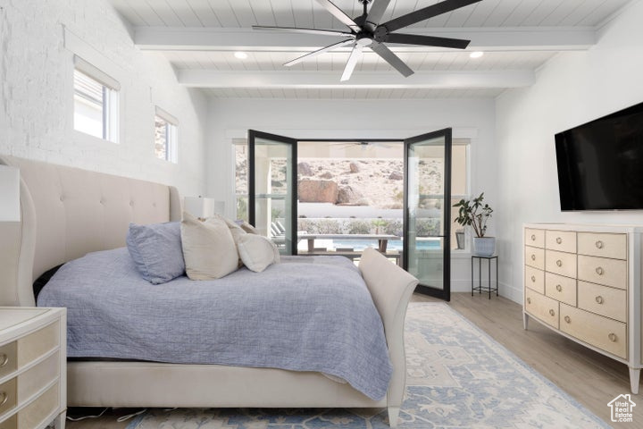 Bedroom with beamed ceiling, ceiling fan, wood ceiling, wood-type flooring, and access to exterior