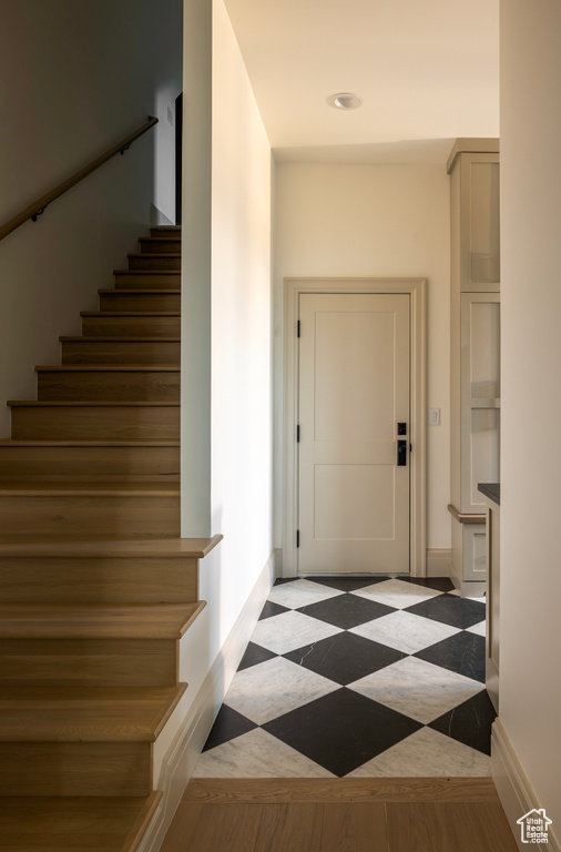 Staircase with wood-type flooring