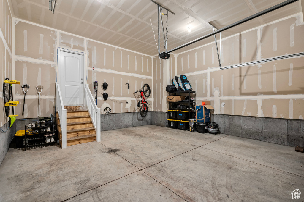 Garage featuring a garage door opener