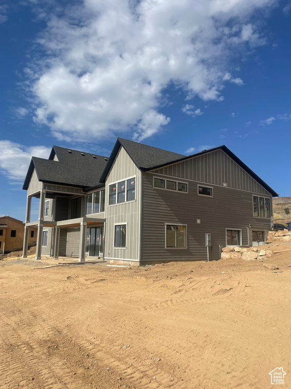 Rear view of property featuring a balcony