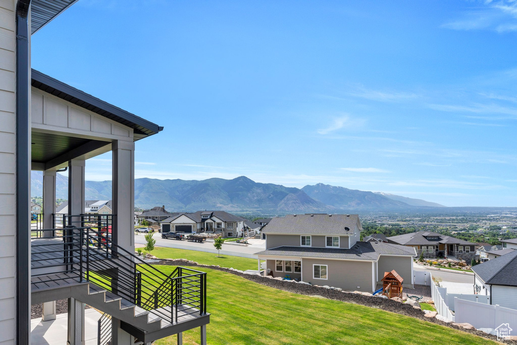 View of mountain backdrop featuring nearby suburban area