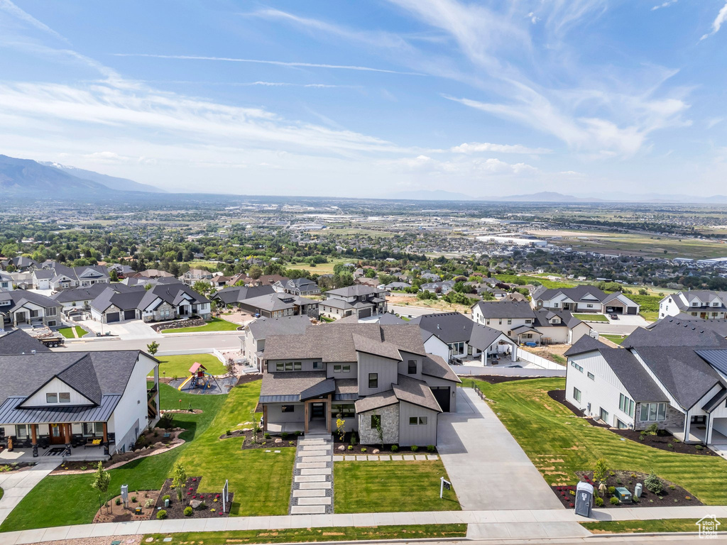 Aerial perspective of suburban area with a mountainous background