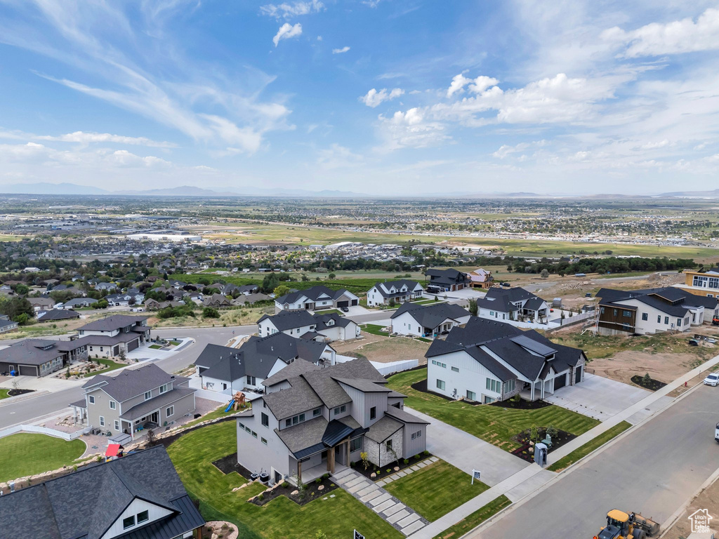 Aerial perspective of suburban area featuring a mountainous background