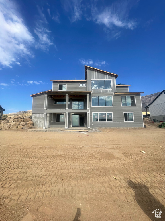 Rear view of property featuring a balcony