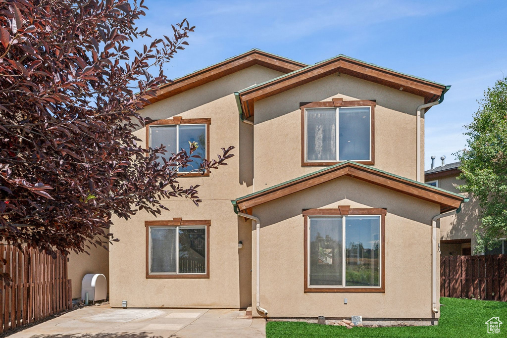 Rear view of property with a patio