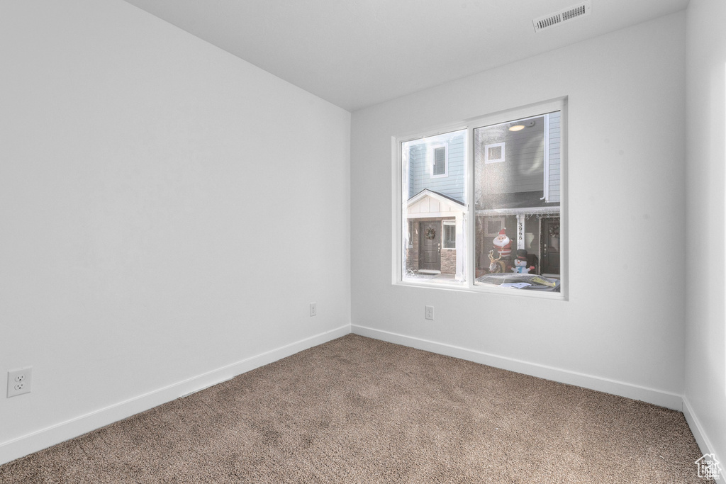 View of carpeted spare room