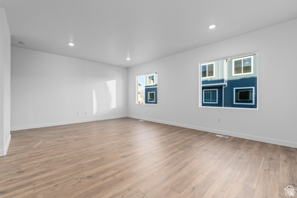 Spare room with light hardwood / wood-style floors