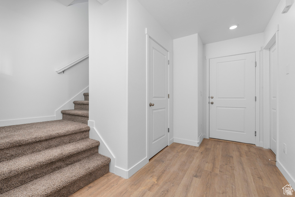 Hallway with light wood-type flooring